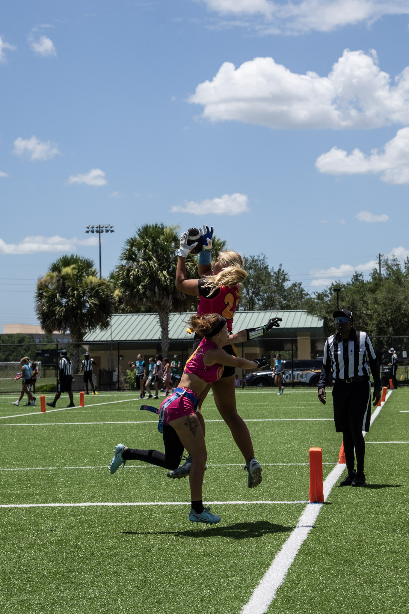 Burger Girlz flag football athlete competing for a catch